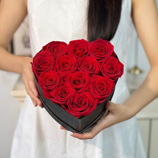 12pc red preserved rose in black heart box