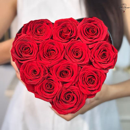 12pc red preserved rose in black heart box