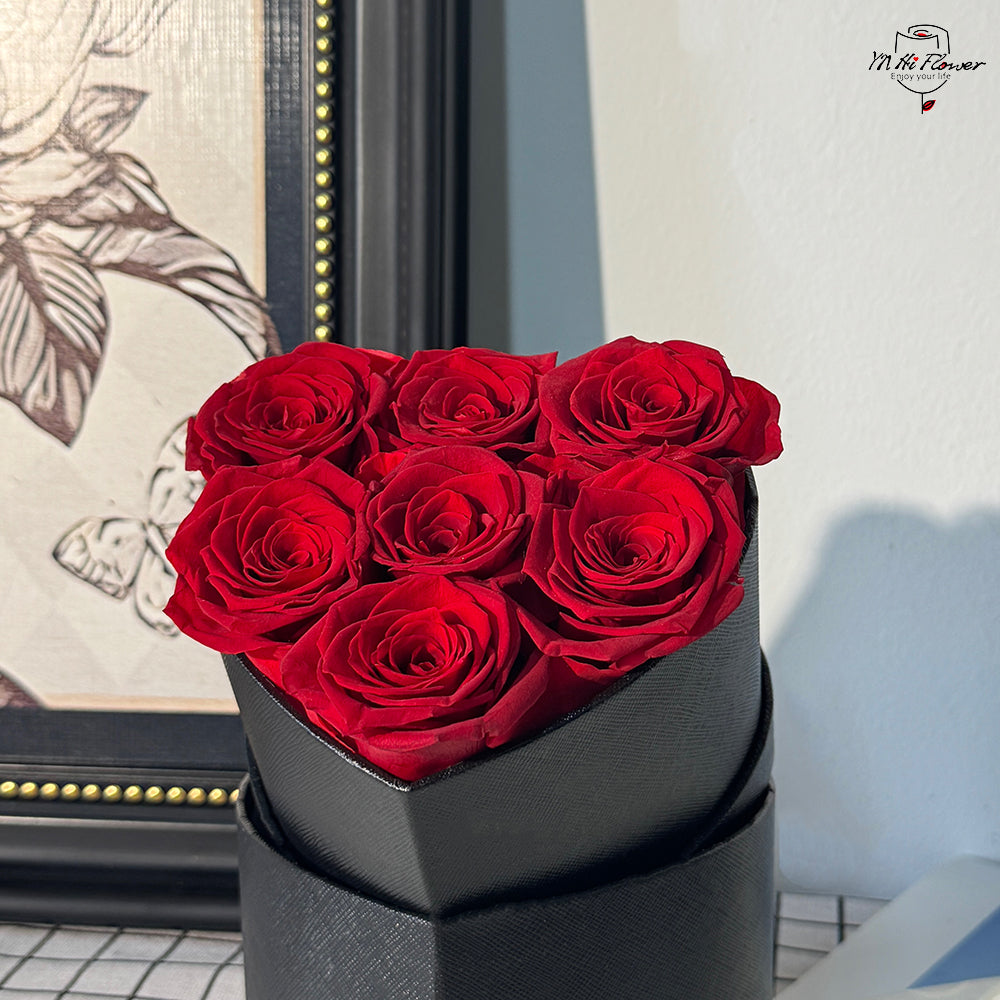 7pc red preserved rose in black heart box