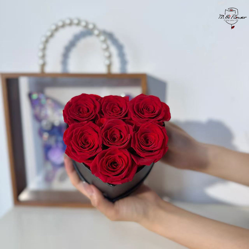 7pc red preserved rose in black heart box