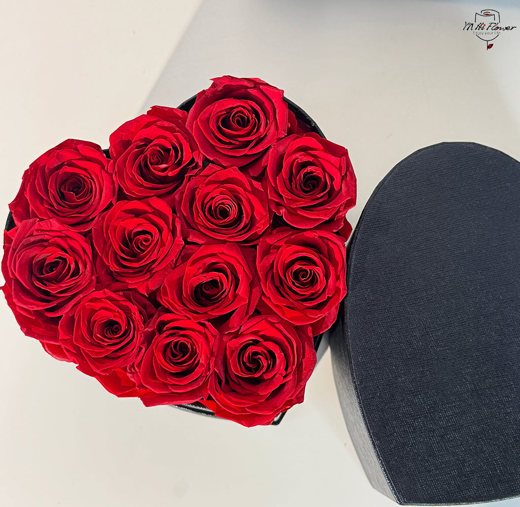 12pc red preserved rose in black heart box
