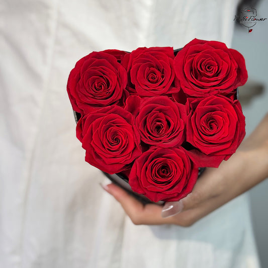 7pc red preserved rose in black heart box