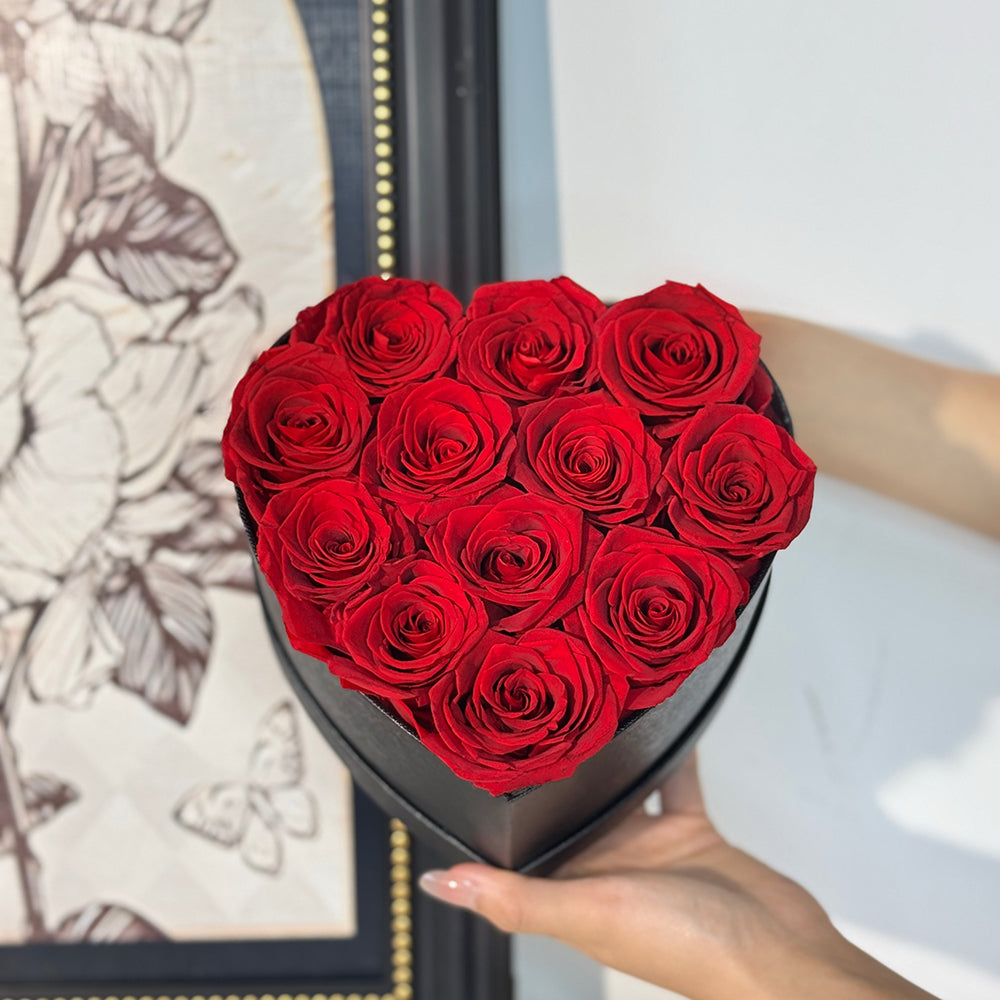 12pc red preserved rose in black heart box