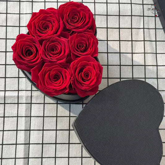 7pc red preserved rose in black heart box
